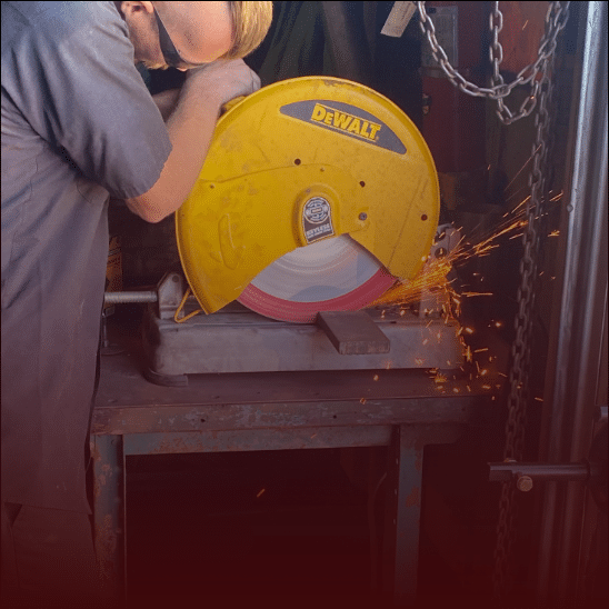 A technician doing custom fabrication at RDI Power