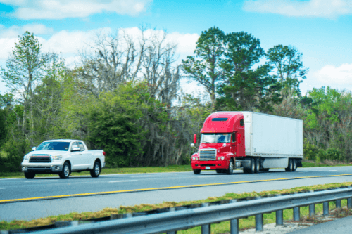 Florida Fall Car Care for Diesels, RVs, and Fleet Vehicles with RDI Power in Spring Hill FL; image of pickup truck and big rig truck driving on highway in Florida