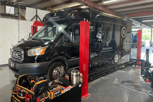 Truck Wheel Alignment Services in Brooksville, FL. Image of a black 2017 Ford Transit Limo undergoing wheel alignment services at RDI Power.