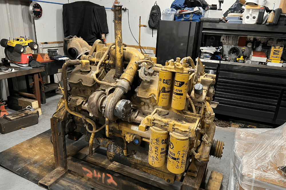 Common Quirks and Fixes with the Caterpillar 3406 PEEC Engine by RDI Power. An image of a Caterpillar 3406 PEEC engine in a workshop, highlighting the importance of addressing common engine issues such as electronic control malfunctions, fuel system problems, and overheating to ensure reliable performance.