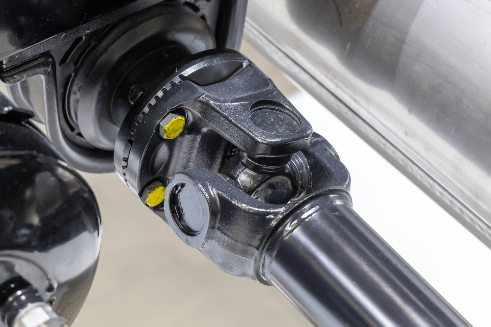 RV U-joints, diesel repair in Brooksville, FL at RDI Power. Close-up of a vehicle's driveshaft and universal joint (U-joint) assembly.