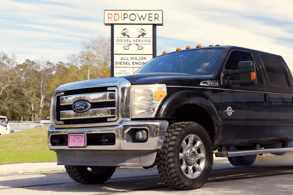 Diesel truck maintenance, diesel repair in Brooksville, FL by RDI Power. Image of a Ford Super Duty diesel truck parked outside the RDI Power facility, highlighting professional diesel diagnostics, maintenance, and performance upgrades for heavy-duty trucks.