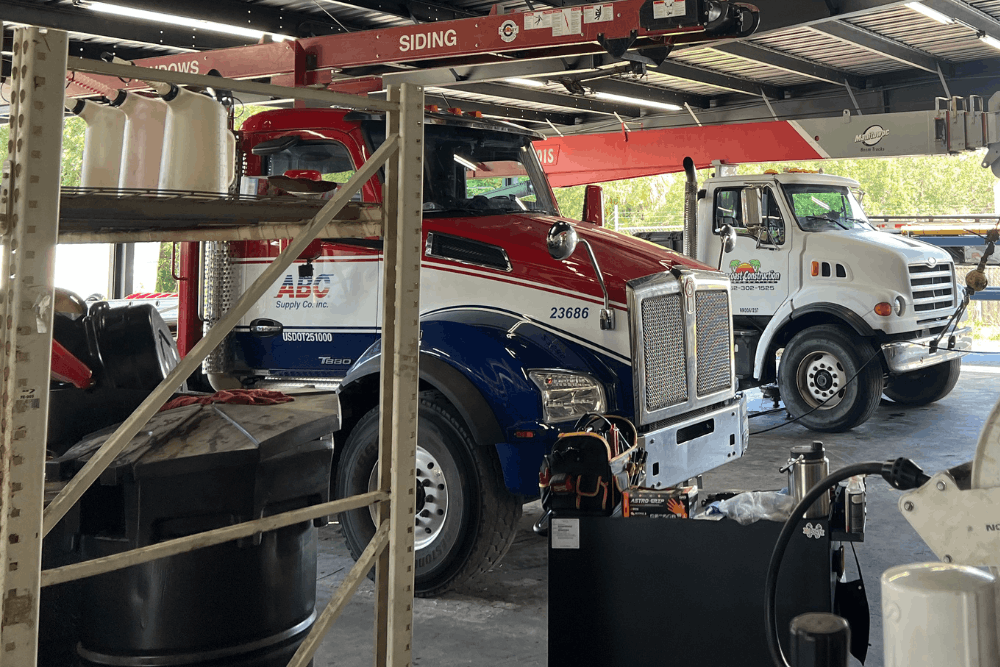 DPF and regen problems, diesel repair in Brooksville, FL at RDI Power. Image of commercial heavy-duty trucks in a professional repair facility receiving expert fleet maintenance and repair services.
